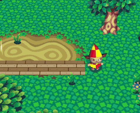 A player walking along a wooden boardwalk, across a brick plaza and down a cobbled path, all laid from their own designs.
